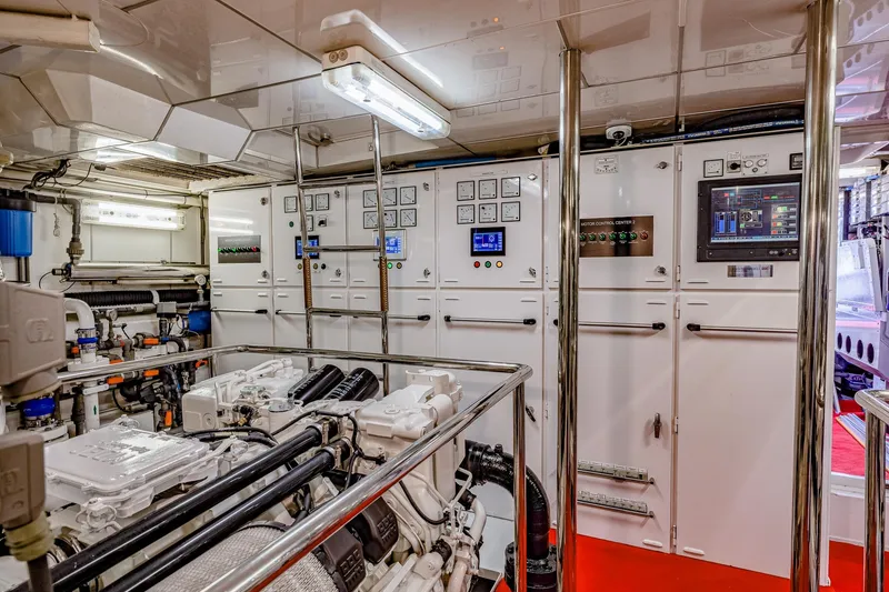 Slide: The Image of Engine room of 2004 Holland Jachtbouw Custom yacht, featuring control panels and machinery. - 66