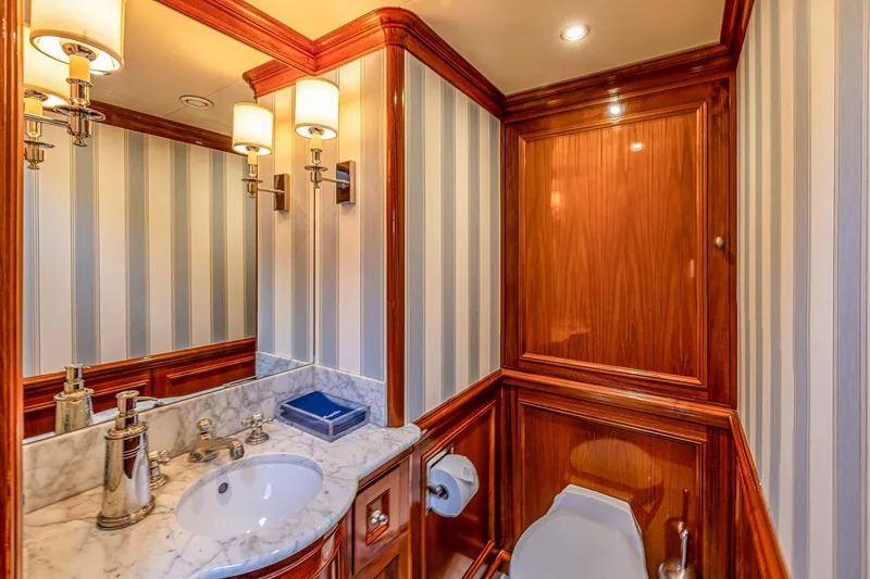 Slide: The Image of Luxurious yacht bathroom with marble sink, elegant wood paneling, and striped wallpaper, 2004 Holland Jachtbouw. - 33