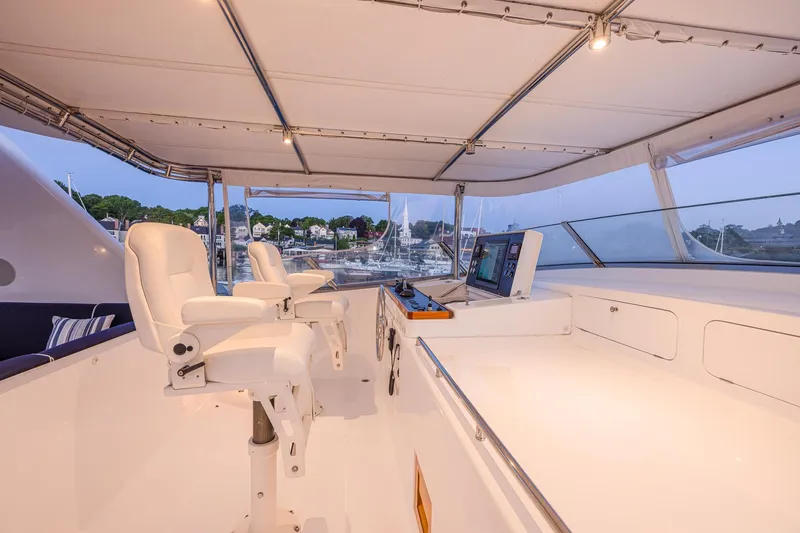 Slide: The Image of Luxurious 2004 Holland Jachtbouw Custom yacht helm with white seating and navigation equipment. - 24