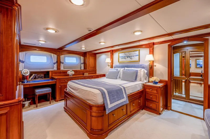Slide: The Image of Luxurious yacht bedroom with elegant wood finish, featuring a comfortable bed and stylish decor, 2004 Holland Jachtbouw Custom. - 45