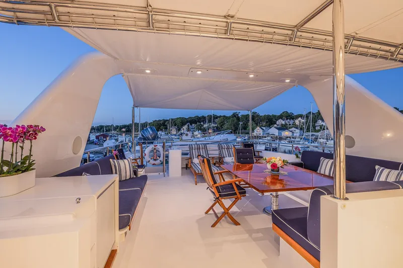 Slide: The Image of Luxurious 2004 Holland Jachtbouw Custom yacht deck with elegant seating and dining area. - 30