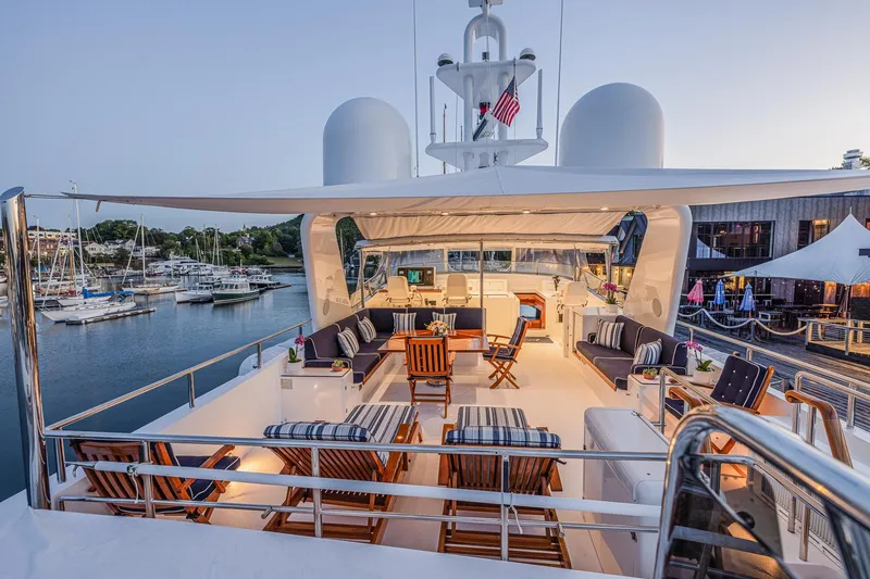 Slide: The Image of Luxurious 2004 Holland Jachtbouw Custom yacht deck with elegant seating and marina view. - 28