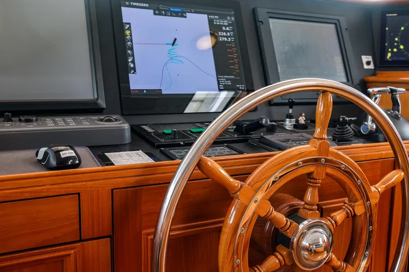 Slide: The Image of Wooden helm and navigation equipment on 2004 Holland Jachtbouw Custom yacht. - 59
