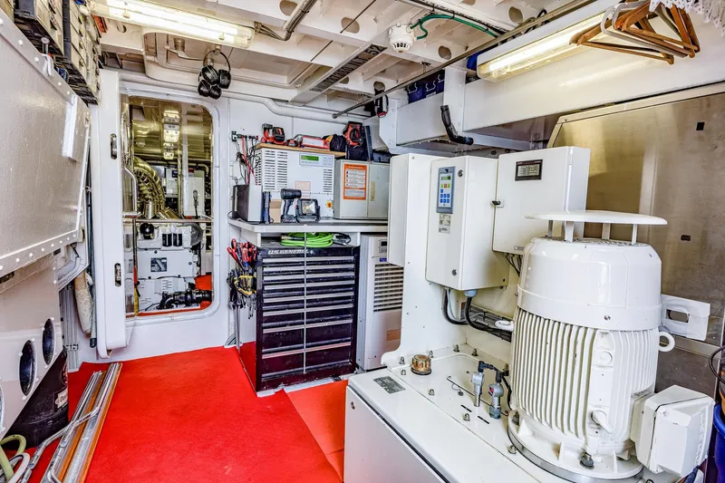 Slide: The Image of Engine room of 2004 Holland Jachtbouw Custom yacht with red flooring and technical equipment. - 68