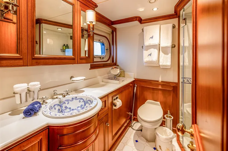 Slide: The Image of Luxurious yacht bathroom with elegant wood cabinetry, ornate sink, and plush towels, 2004 Holland Jachtbouw. - 46