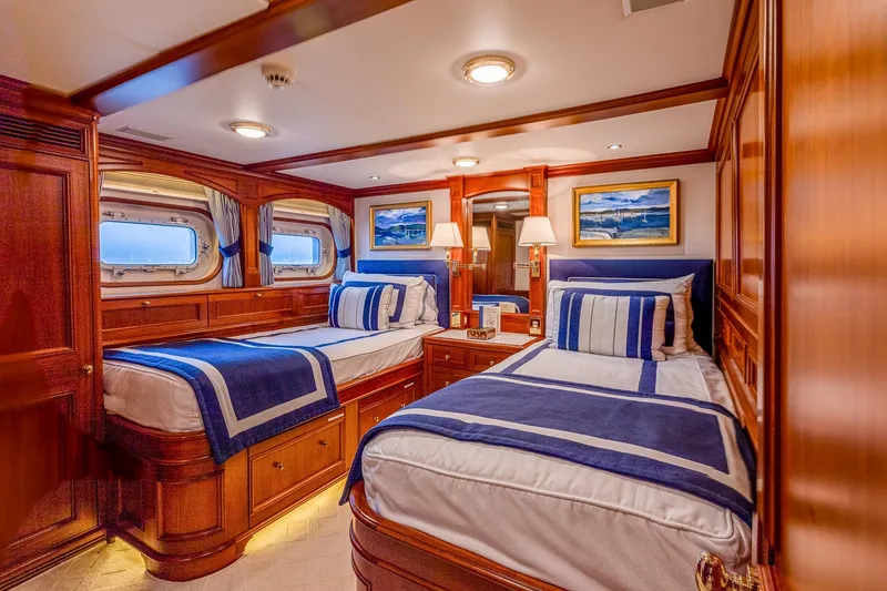 Slide: The Image of Luxurious yacht cabin with twin beds, elegant wood paneling, and nautical decor, Holland Jachtbouw 2004. - 48