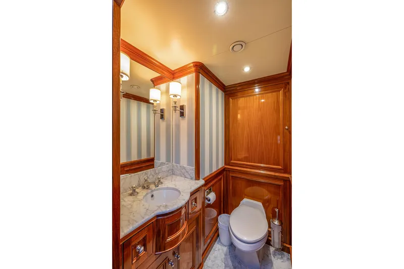 Slide: The Image of Luxurious yacht bathroom with marble sink, wooden cabinetry, and elegant lighting, Holland Jachtbouw Custom 2004. - 36