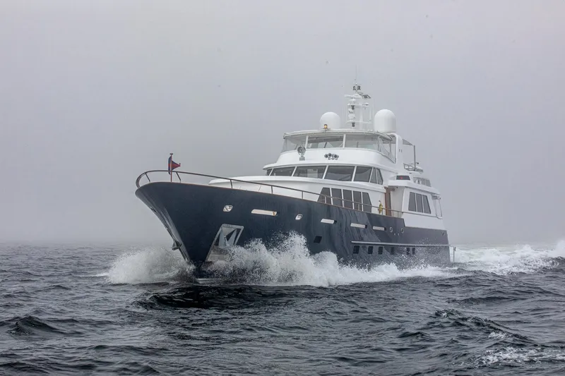 Slide: The Image of Luxurious 2004 Holland Jachtbouw Custom yacht navigating through misty waters. - 51