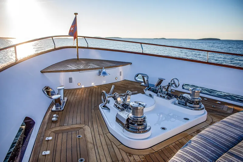 Slide: The Image of Luxurious 2004 Holland Jachtbouw Custom yacht deck with winches, ocean view, and sunset. - 18