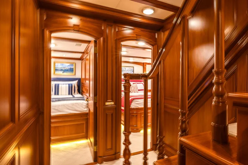 Slide: The Image of Luxurious wooden interior of 2004 Holland Jachtbouw Custom yacht, featuring elegant bedrooms and staircase. - 39