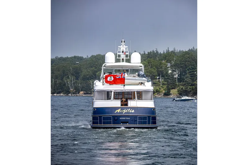 Slide: The Image of Luxury yacht "Avigilis" by Holland Jachtbouw, 2004, cruising on a scenic waterway. - 76