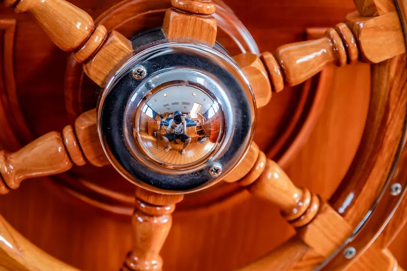 Slide: The Image of Close-up of a polished wooden ship wheel, Holland Jachtbouw Custom, 2004. - 58