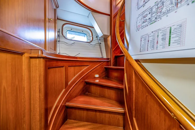 Slide: The Image of Luxurious wooden staircase inside 2004 Holland Jachtbouw Custom yacht, featuring elegant design and craftsmanship. - 34