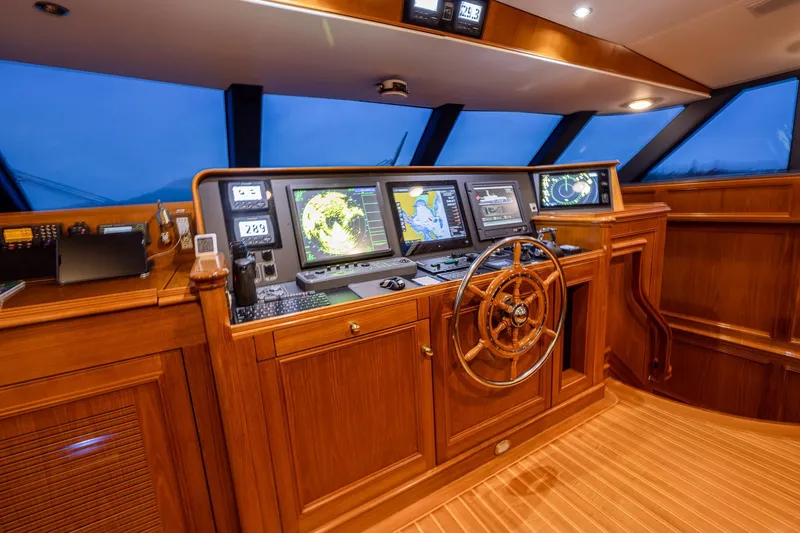 Slide: The Image of Luxurious 2004 Holland Jachtbouw Custom yacht helm with advanced navigation systems and wooden steering wheel. - 38