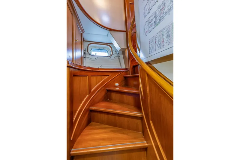 Slide: The Image of Wooden staircase inside 2004 Holland Jachtbouw Custom yacht, featuring elegant curved design. - 35