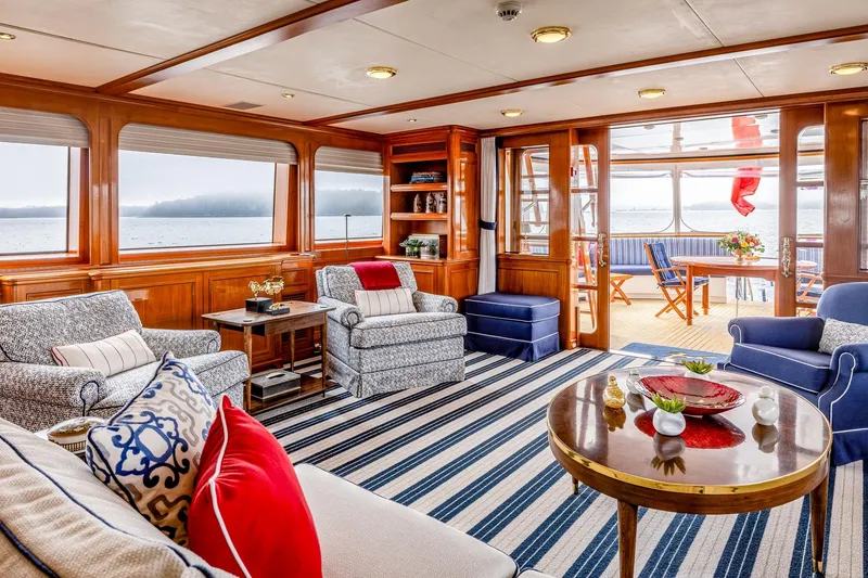 Slide: The Image of Luxurious yacht interior with elegant seating, striped rug, and panoramic ocean views, Holland Jachtbouw Custom 2004. - 52