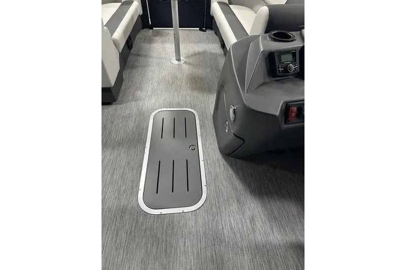 Slide: The Image of Interior of 2026 Bennington S Swingback 22 SSB pontoon boat, featuring sleek seating and control console. - 2