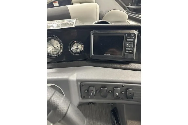 Slide: The Image of Dashboard of 2026 Bennington S Swingback 22 SSB with Garmin display and controls. - 9