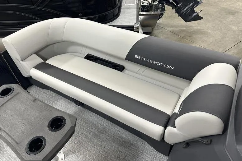 Slide: The Image of 2026 Bennington S Swingback 22 SSB boat seating, featuring sleek gray and white upholstery. - 4