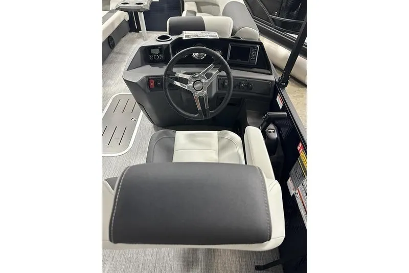 Slide: The Image of 2026 Bennington S Swingback 22 SSB boat interior with steering wheel and seating. - 10