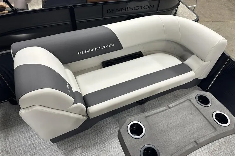 Slide: The Image of 2026 Bennington S Swingback 22 SSB boat seating with cup holders, featuring sleek gray and white design. - 3