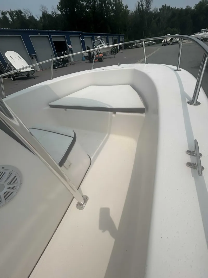 Slide: The Image of The image shows the bow of a 2015 Tidewater 180 CC Adventurer with seating and railing. - 4