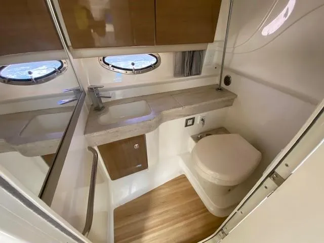 Slide: The Image of 2017 Formula 350 Sun Sport bathroom with modern fixtures and wooden cabinetry. - 34