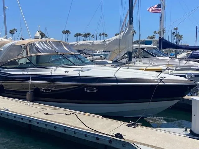 Slide: The Image of 2017 Formula 350 Sun Sport boat docked at a marina with clear blue skies. - 6