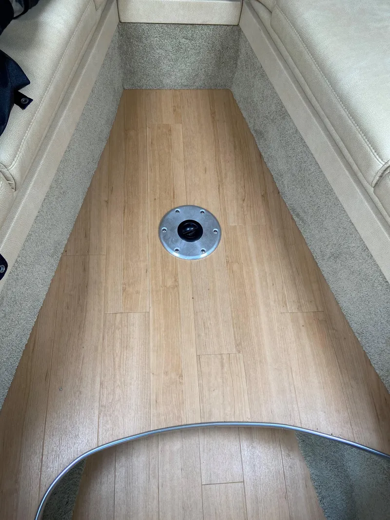 Slide: The Image of Interior seating area of a 2017 Formula 350 Sun Sport boat with wooden flooring. - 28