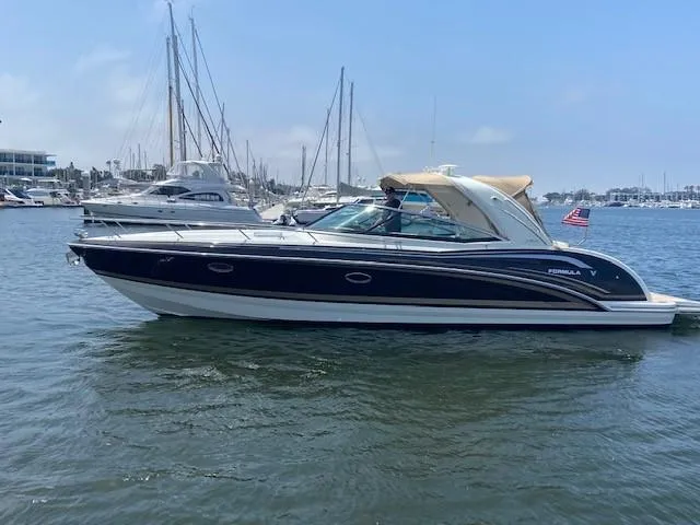 Slide: The Image of 2017 Formula 350 Sun Sport boat docked in a marina. - 4