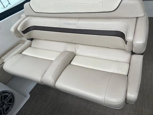 Slide: The Image of 2017 Formula 350 Sun Sport boat interior seating with beige leather upholstery. - 17