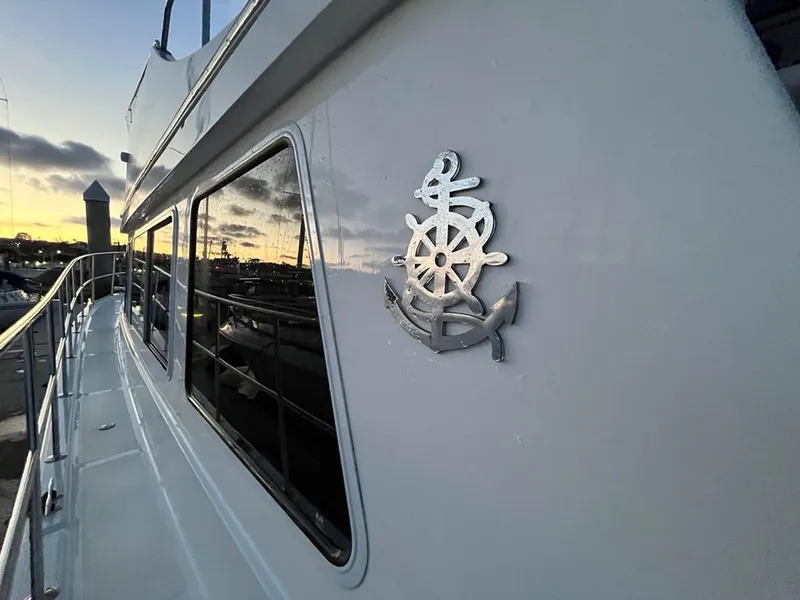 Slide: The Image of Bracewell 41 yacht, 2025 model, docked at sunset with nautical emblem. - 49