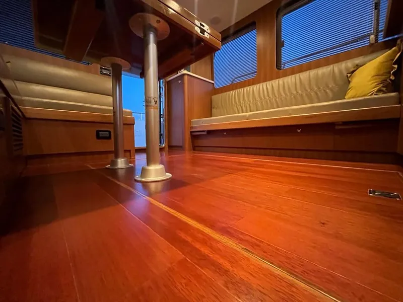 Slide: The Image of Luxurious Bracewell 41 yacht interior with polished wood flooring and comfortable seating, 2025 model. - 48
