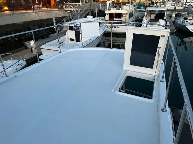 Slide: The Image of Bracewell 41 (2027) at a calm dock, featuring a spacious deck and railing. - 55