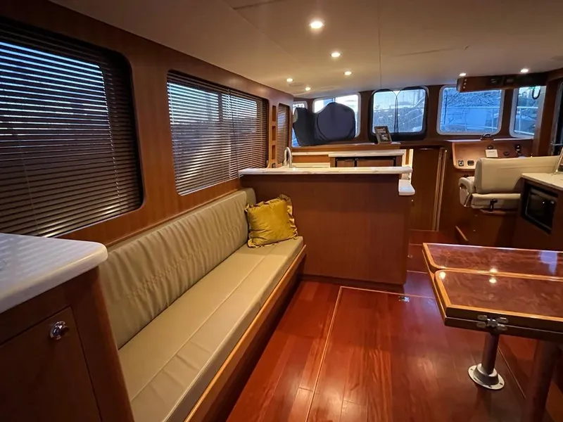 Slide: The Image of Luxurious interior of 2025 Bracewell 41 yacht with wood finishes and modern seating. - 44