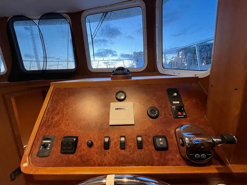 Slide: The Image of Bracewell 41 yacht helm, 2025 model, featuring control panel and windows with evening view. - 38