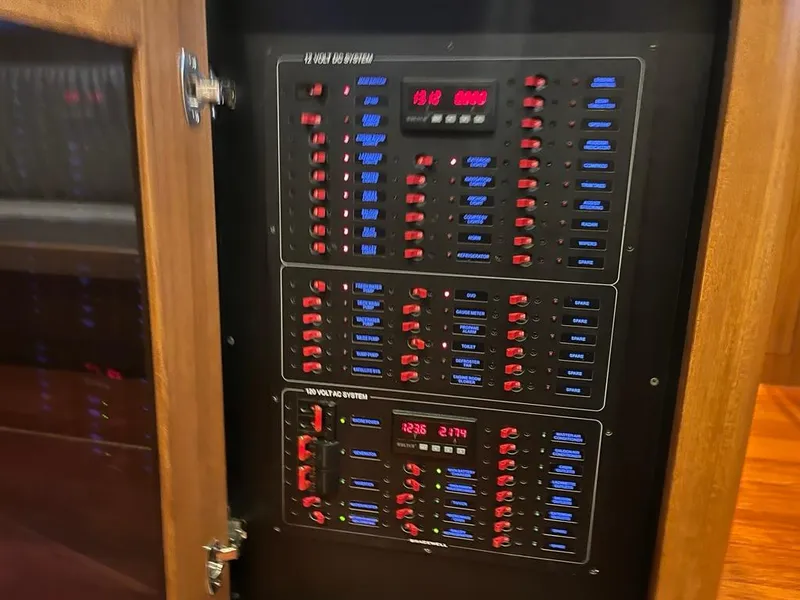 Slide: The Image of Electrical control panel inside a 2025 Bracewell 41 boat, featuring switches and indicators. - 36