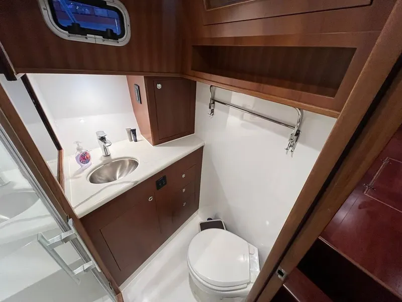 Slide: The Image of Luxurious bathroom in 2025 Bracewell 41 yacht with modern fixtures and wood cabinetry. - 26