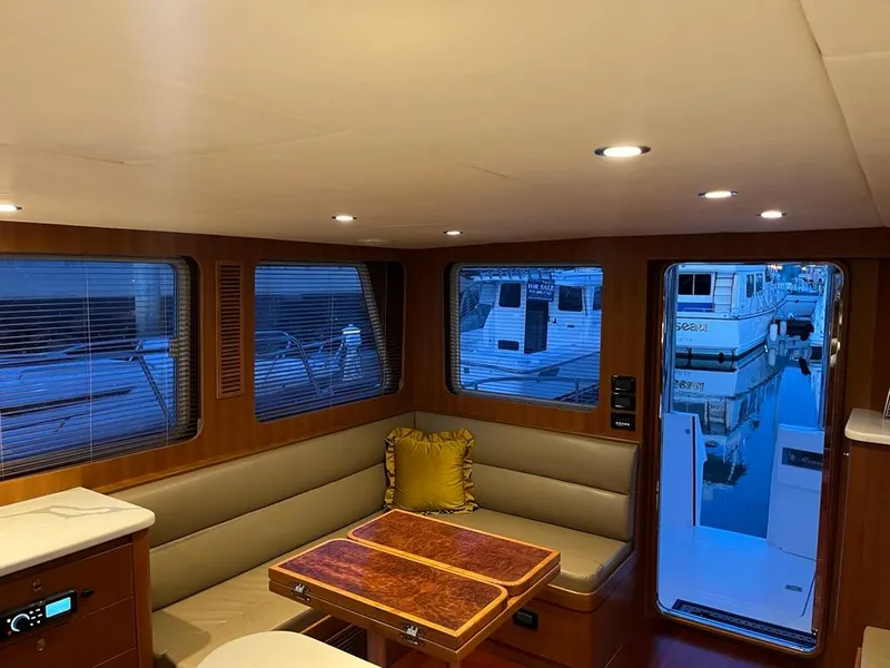 Slide: The Image of Luxurious interior of 2025 Bracewell 41 yacht with elegant seating and table. - 47