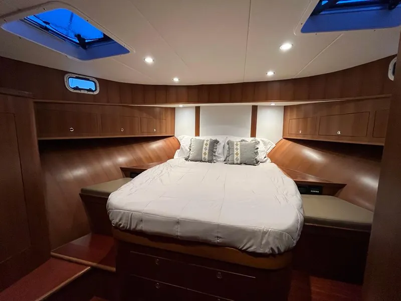 Slide: The Image of Luxurious 2025 Bracewell 41 yacht cabin with cozy bed and elegant wood finish. - 19
