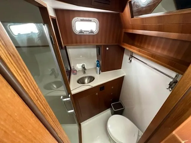 Slide: The Image of Modern bathroom in 2025 Bracewell 41 yacht with wood accents and compact design. - 12