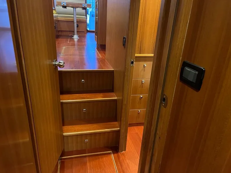 Slide: The Image of Interior of 2025 Bracewell 41 yacht with wooden stairs and cabinetry. - 27