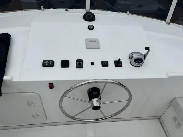 Slide: The Image of Bracewell 41 boat helm with steering wheel and control panel, 2025 model. - 3