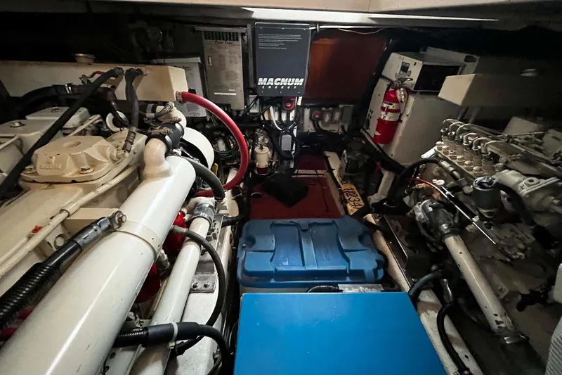 Slide: The Image of Engine room of 1997 Ocean Alexander 440 Sundeck CPMY with visible machinery and equipment. - 30