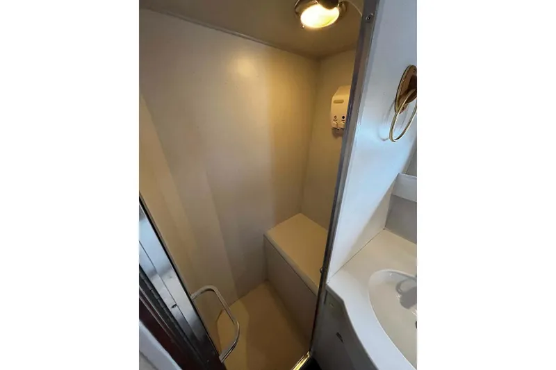 Slide: The Image of 1997 Ocean Alexander 440 Sundeck CPMY bathroom with shower and sink. - 25