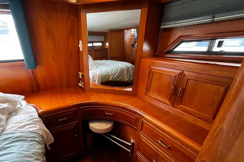 Slide: The Image of Luxurious wooden interior of 1997 Ocean Alexander 440 Sundeck CPMY yacht cabin. - 24
