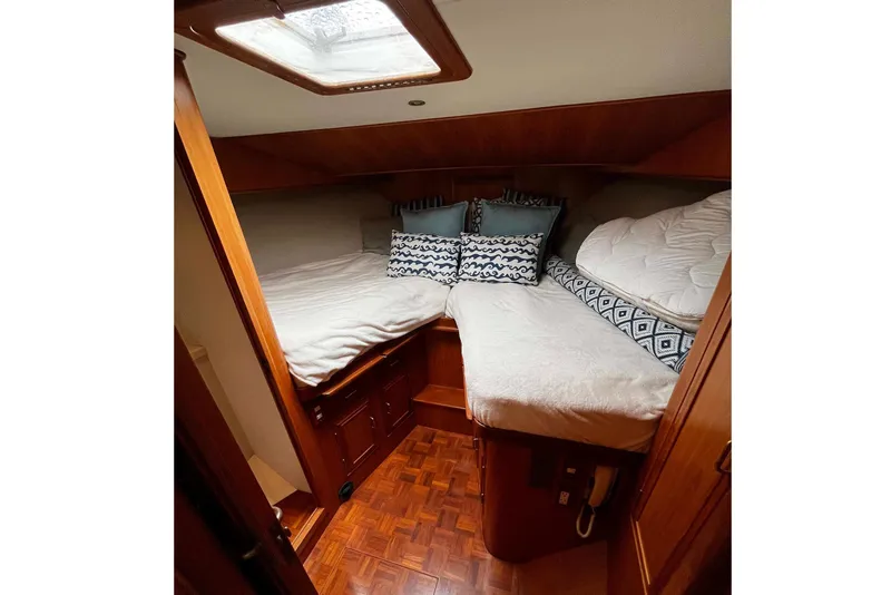 Slide: The Image of Cozy cabin interior of 1997 Ocean Alexander 440 Sundeck CPMY with twin beds and decorative pillows. - 20