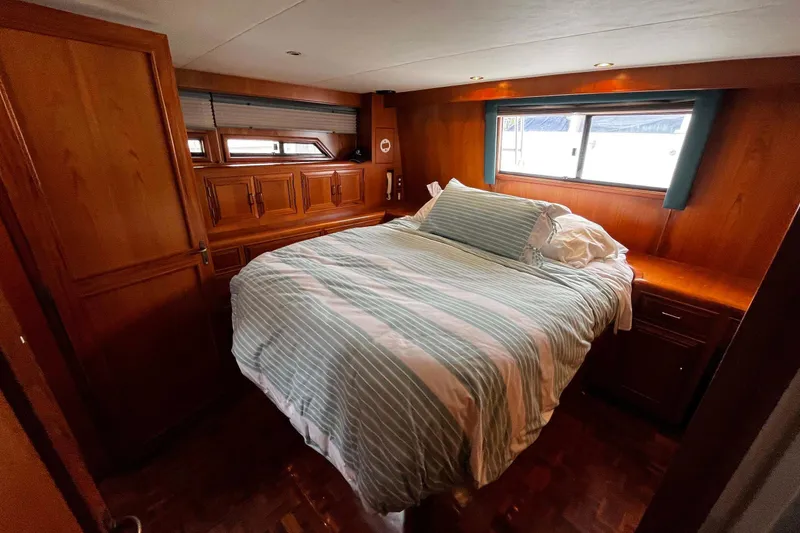 Slide: The Image of Cozy bedroom in 1997 Ocean Alexander 440 Sundeck CPMY yacht with wood paneling. - 22