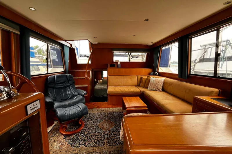 Slide: The Image of Luxurious interior of 1997 Ocean Alexander 440 Sundeck CPMY with plush seating and elegant wood finishes. - 15