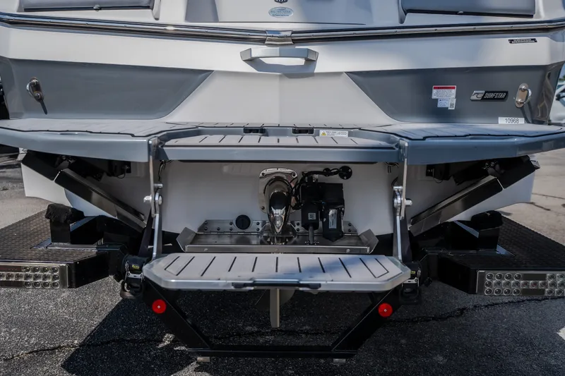 Slide: The Image of 2024 MasterCraft XT25 boat stern with swim platform and surf system. - 6